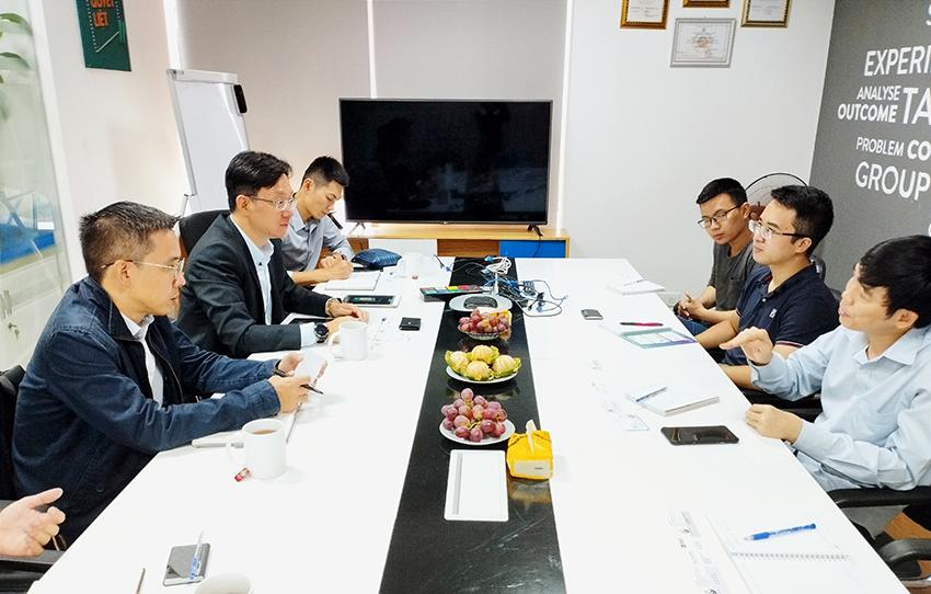 ADI's Senior Manager for East Asia and Pacific – Mr. Philip Tseng (centre left) - listens to share about pioneering technology features on Smart Vending Machines SVM